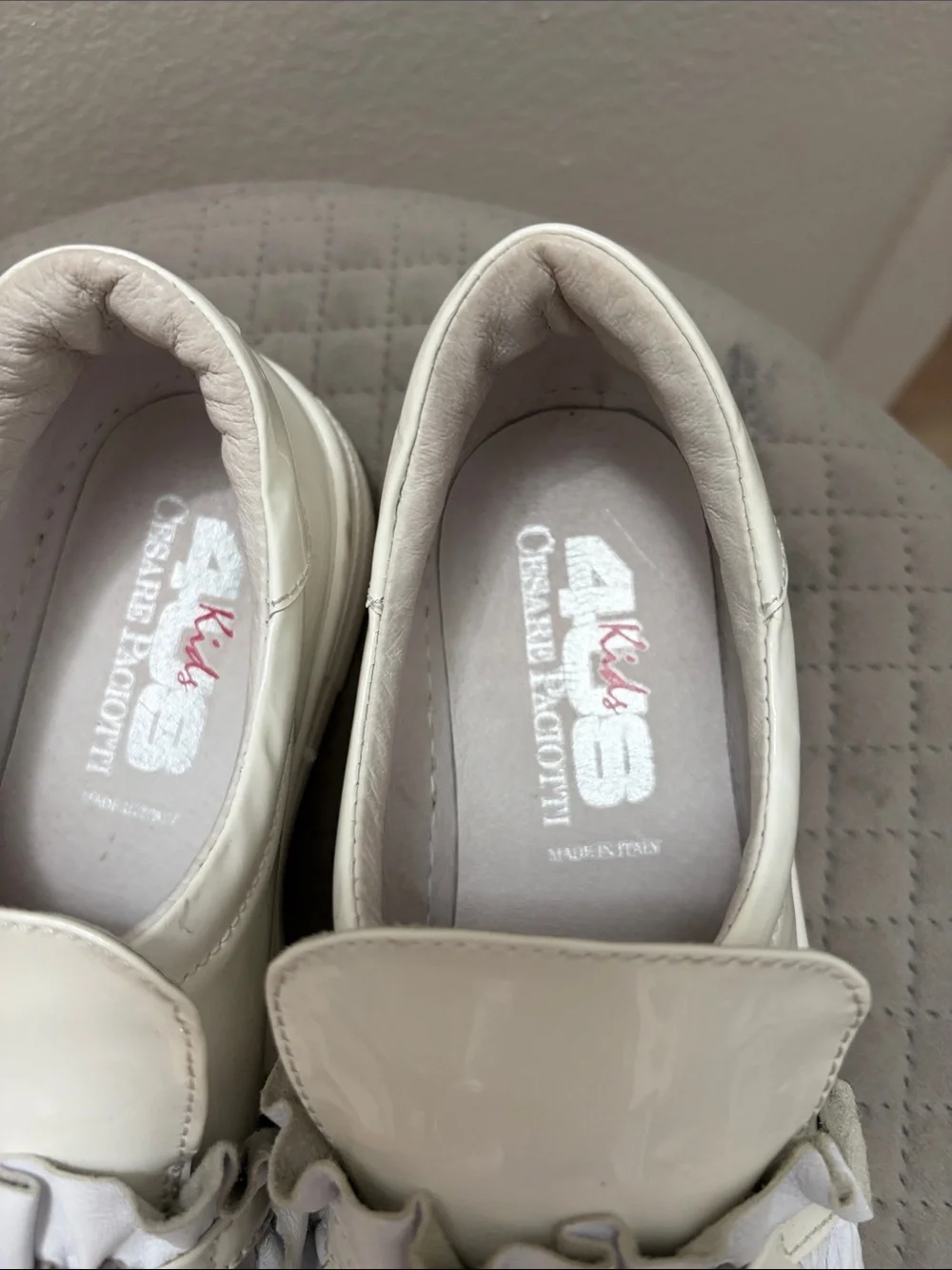 Cesare Paciotti White Patent Leather Slip-Ons with Ruffle Detail